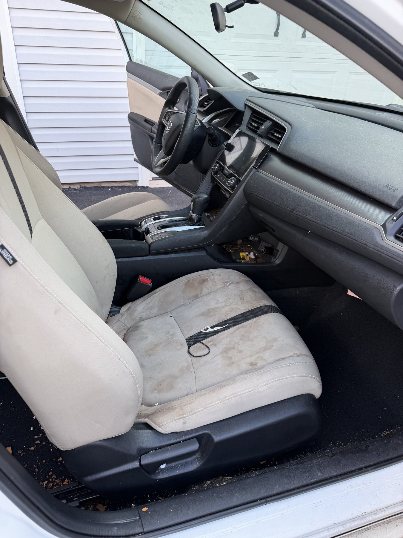 Before detailing: stained Honda Civic cloth seats and debris