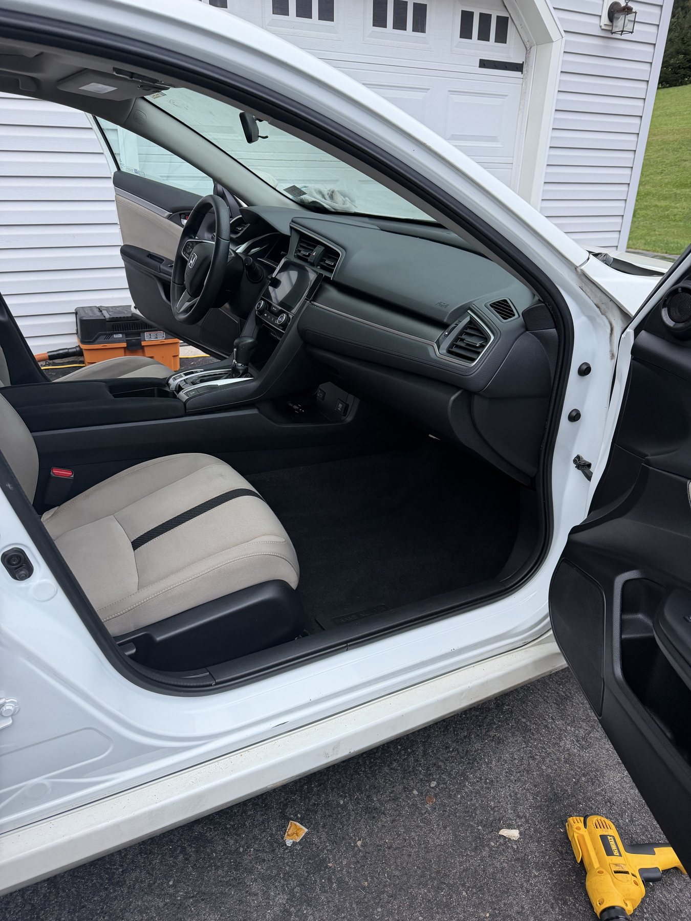 After detailing: cleaned Honda Civic cloth seats, carpet, and dashboard